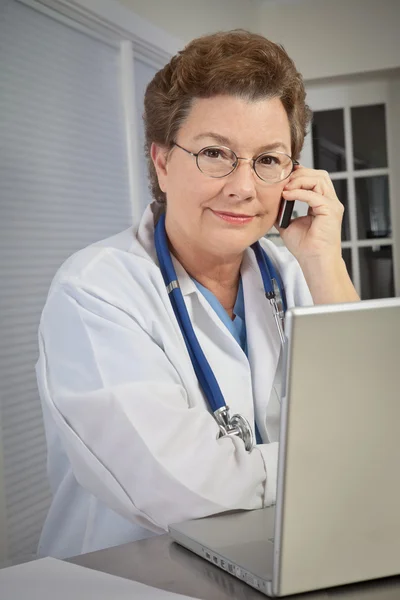 Woman Doctor Talking on Phone