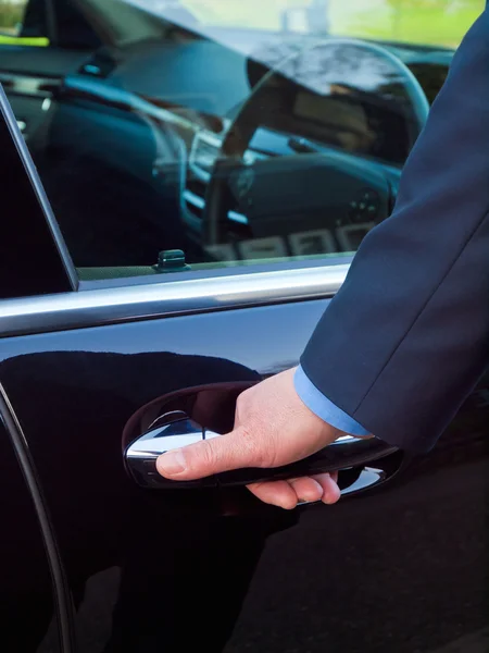 Hand on a car door