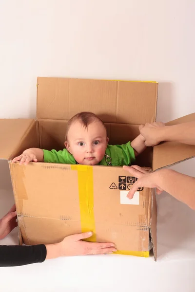 Kid climbs out of the box