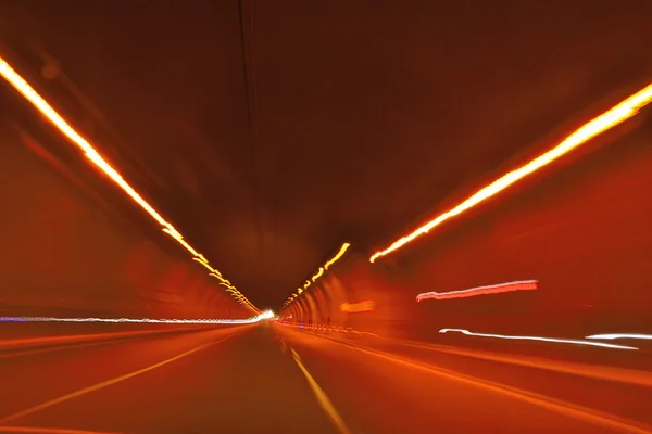 Highway tunnel at night and speed