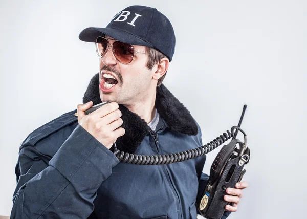 Action FBI agent wearing blue jacket, sunglasses with vintage mustache