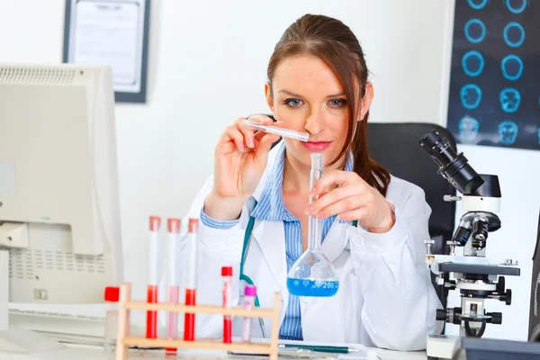 Doctor woman working with test tube in laboratory