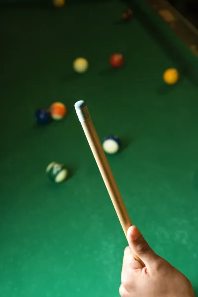 Hand Holding Pool Cue