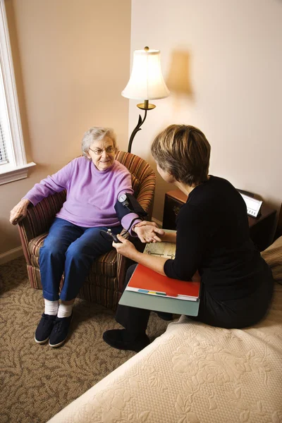 Elderly Woman Having Blood Pressure Taken