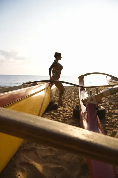Woman with outrigger.
