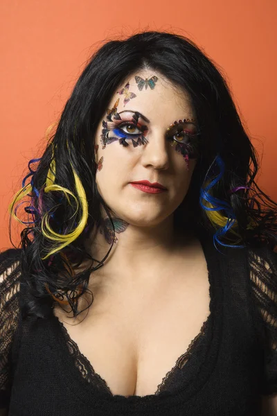 Woman wearing unique makeup.