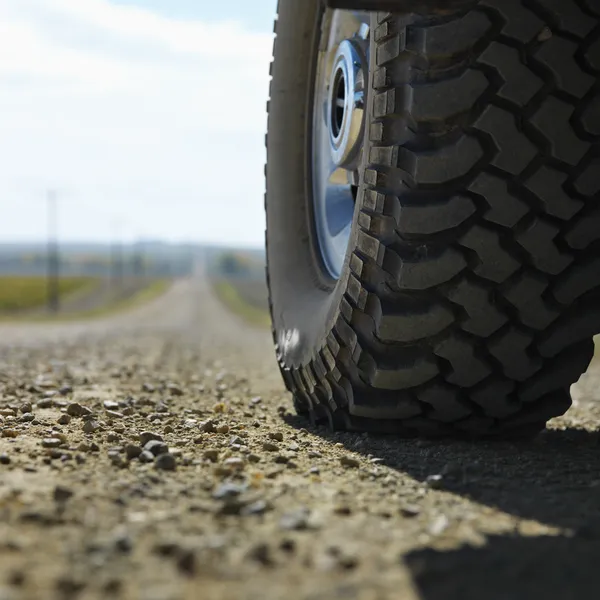 Truck tire on road.