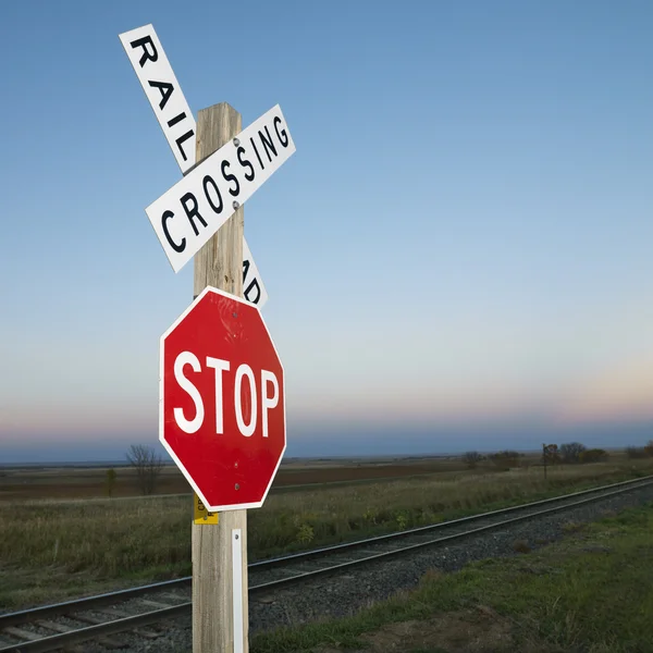Railroad and stop sign.
