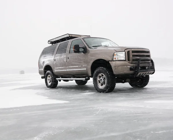 Truck on frozen lake.