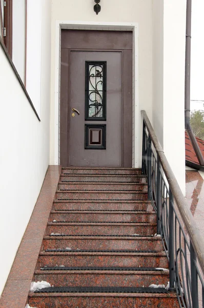 Stairs and a metal door