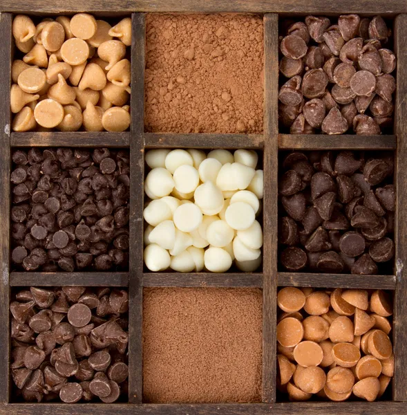 Assorted chocolate chips in a printers box