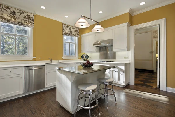 Kitchen with gold walls