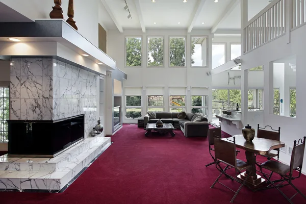 Family room with two story windows