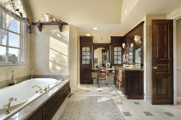 Master bath with dark cabinetry