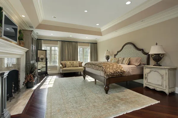 Master bedroom with marble fireplace