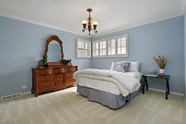 Master bedroom with light blue walls