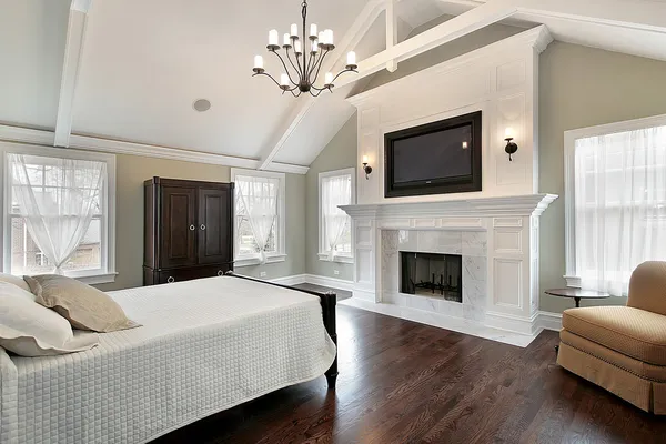 Master bedroom with marble fireplace