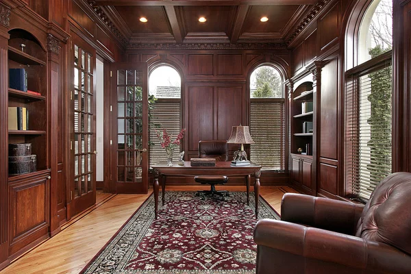 Library with cherry wood paneling