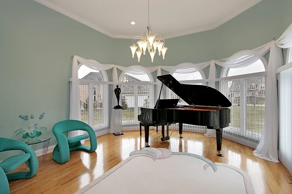 Music room with green chairs