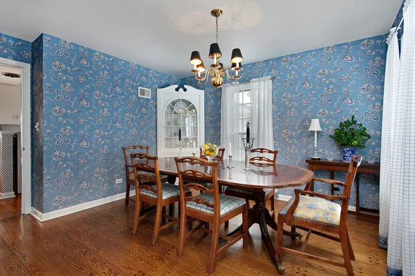 Dining room with blue wallpaper