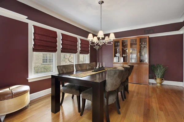 Dining room with maroon walls
