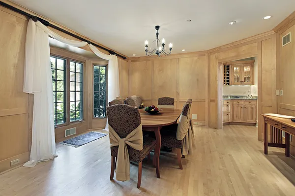 Dining room with oak wood paneling