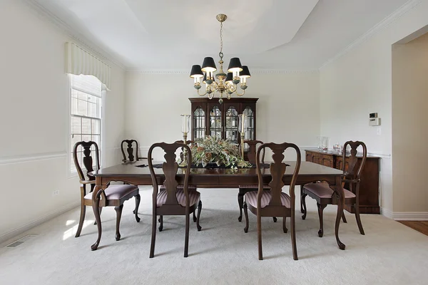 Dining room with white carpeting