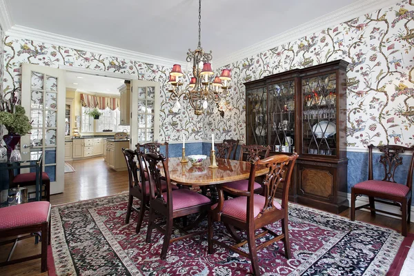 Dining room with floral wallpaper