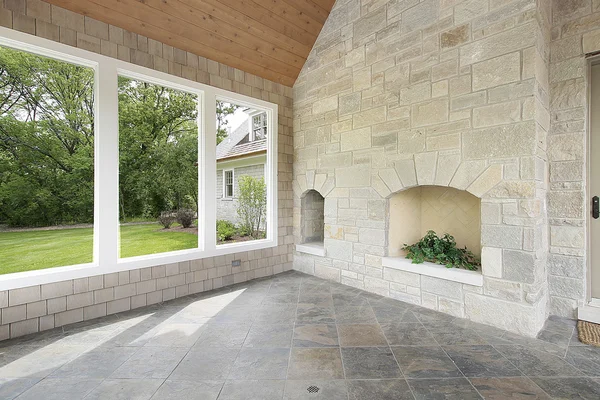 Stone porch with fireplace