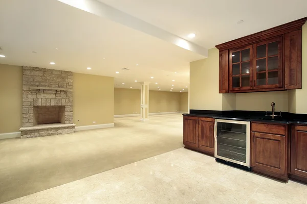 Basement with bar and fireplace