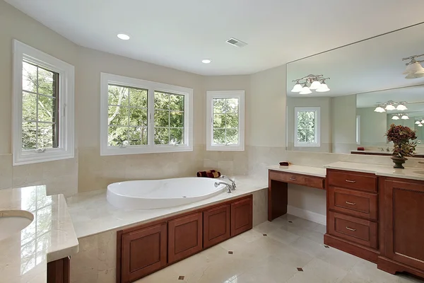 Master bath with wood cabinetry