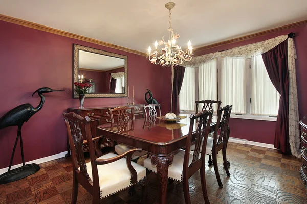 Dining room with maroon walls
