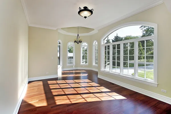 Dining room with cherry wood flooring