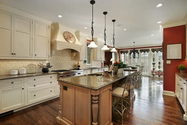 Kitchen with marble island countertop