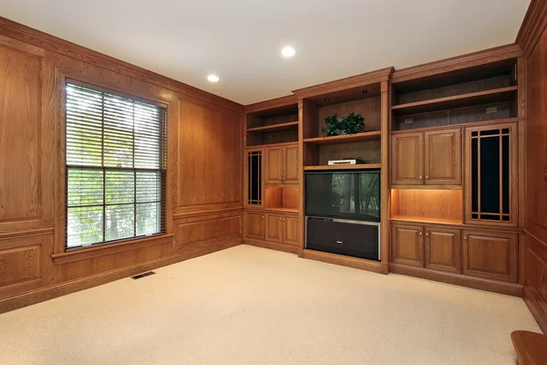 Family room with wood cabinetry