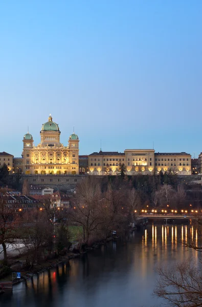 The Federal Palace of Switzerland behind the aar river at dusk
