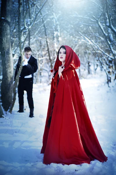 Red Riding Hood in the woods with a man-wolf