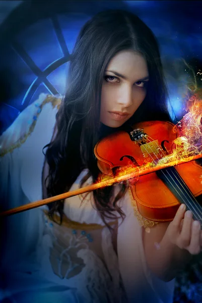 Young attractive woman playing violin