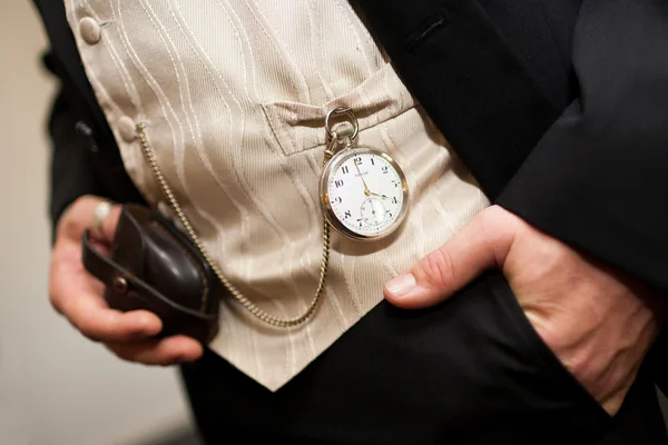 Pocket watch on the waist coat of a groom