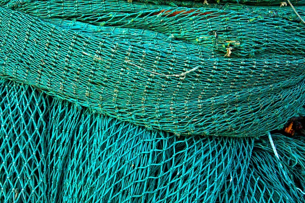 Coiled green fishing netting