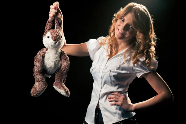 Girl with a toy rabbit