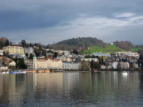 Buildings near lake in Luzern in cloudy weather — Stock Photo #9788018