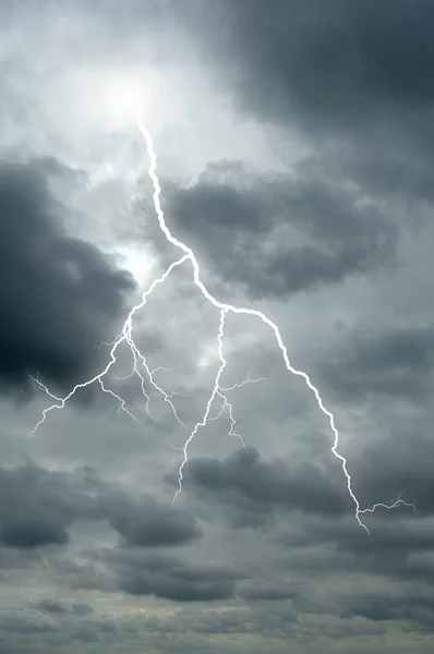 Lightening bolt flashes through a dramatic sky