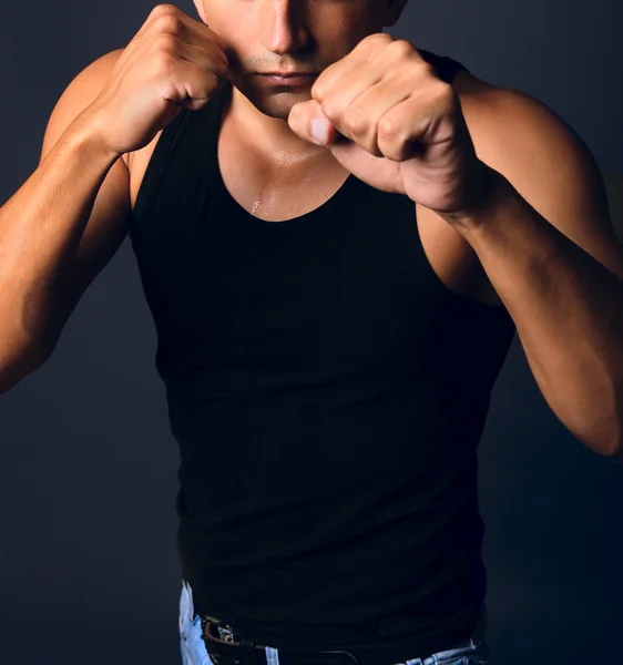 Muscular man in a boxing stance