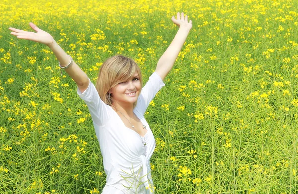 Happy girl in flower field