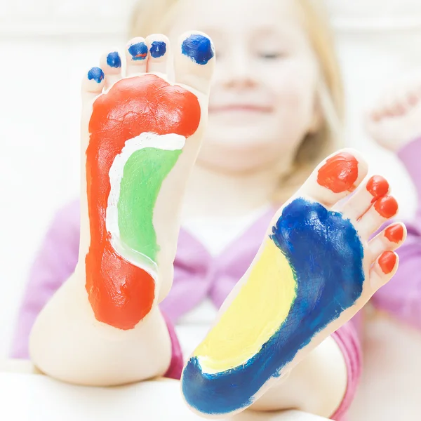 Little girl with feet painted