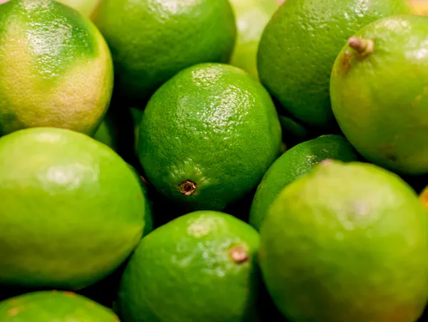 Fresh green limes closeup