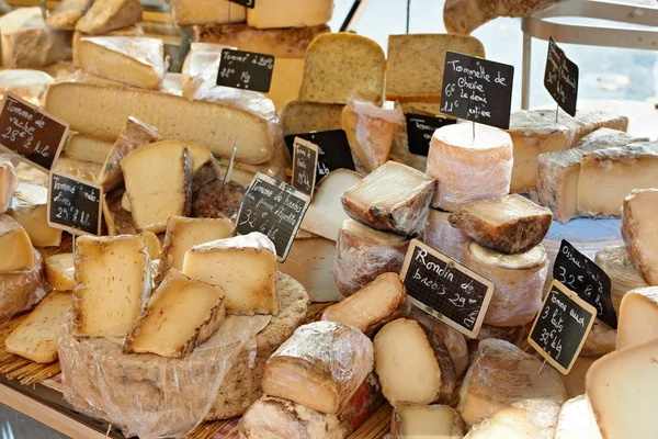 Random French cheese at market of Provence