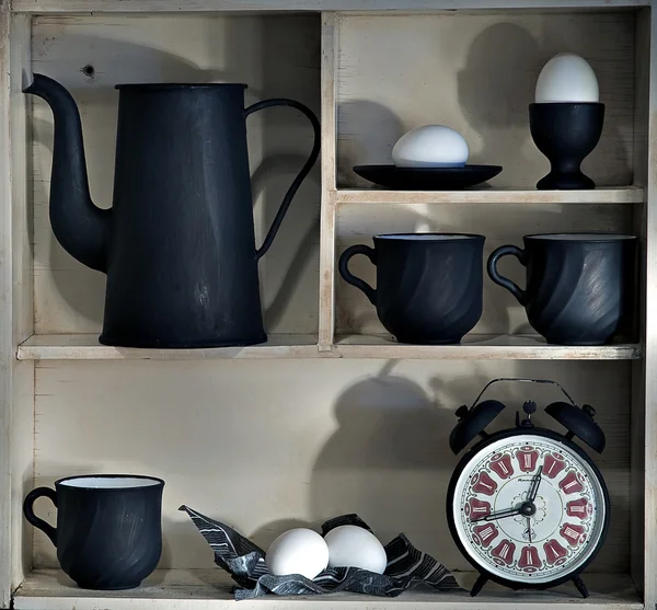 Shelf with dishes of dark