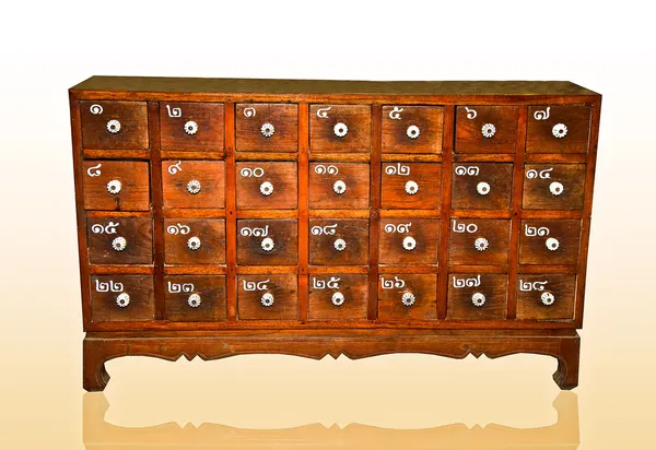 The Wooden cabinet with square drawers and white handle isolated